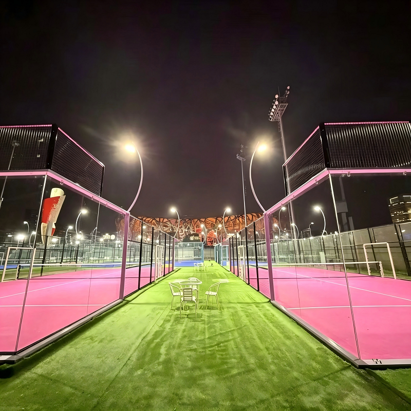 A padel court illuminated at night