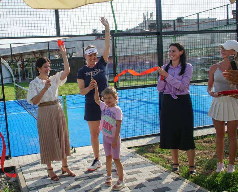 Visitors and players gathered at an XTZ padel court venue