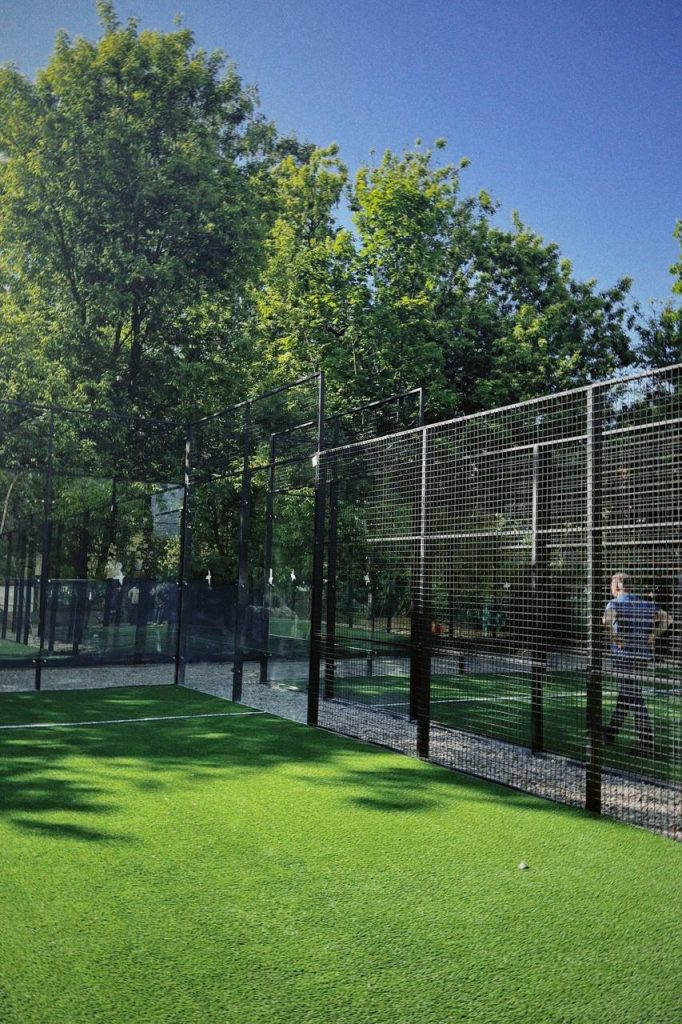 A padel court with green surroundings